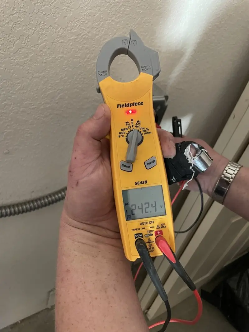Voltage testing with clamp meter during Outlet Installation in Exeter